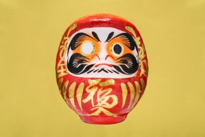 A daruma doll. One eye is painted in when an intention is set, and the other is filled in when the intention has been fulfilled.