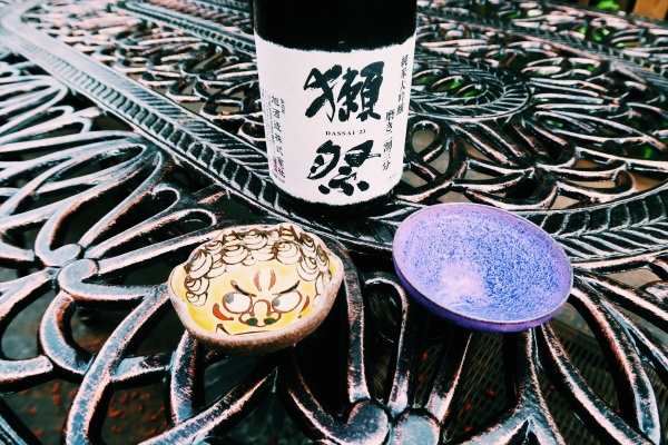 Unseen Japan Tours - a bottle of sake and two ochoko (drinking vessels)