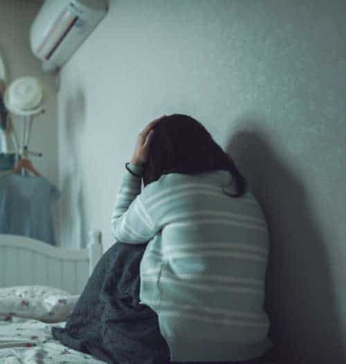 Woman shut up in her room