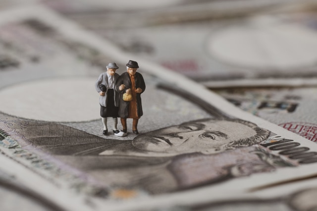 Couple standing on money