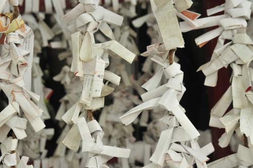 Hundreds of omikuji predicting misfortune at a shrine in Okinawa. That’s a lot of bad mojo.
