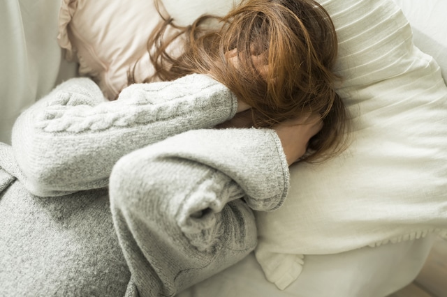 Woman depressed in bed