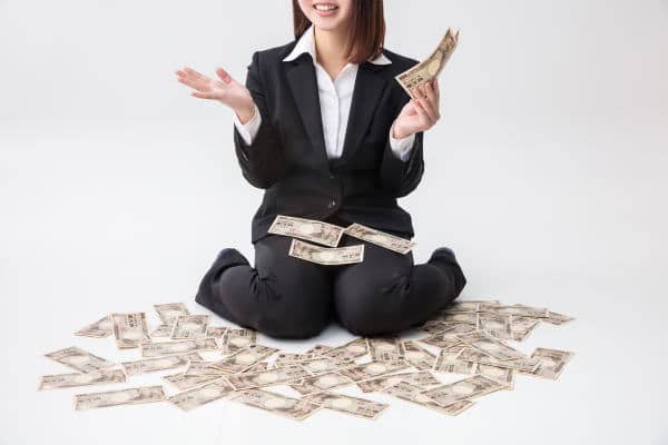 A woman holding money