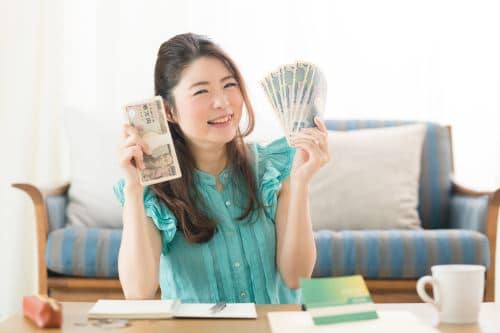 Woman holding money