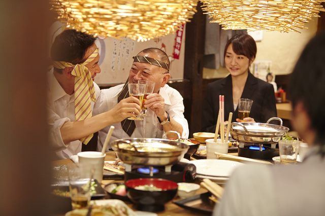 Woman looking at two ojians partying