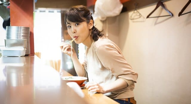 Woman eating ramen