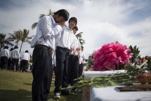 Japanese School students participate in the Ehime Maru Memorial Service at the Ehime Maru Memorial in Kakaako Waterfront Park on Wednesday, February 9, 2011 in Honolulu, Hawaii.