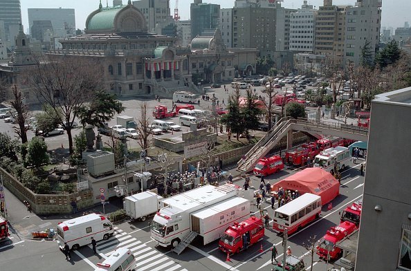 This picture taken on March 20, 1995 shows emergency teams outside Tsukiji subway station following a sarin gas attack by doomsday cult Aum Supreme Truth (Aum Shinrikyo) in Tokyo. -