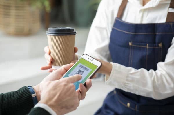 Cashless payment for coffee. Cashless and mobile banking are leaving Japanese banks looking more and more obsolete.