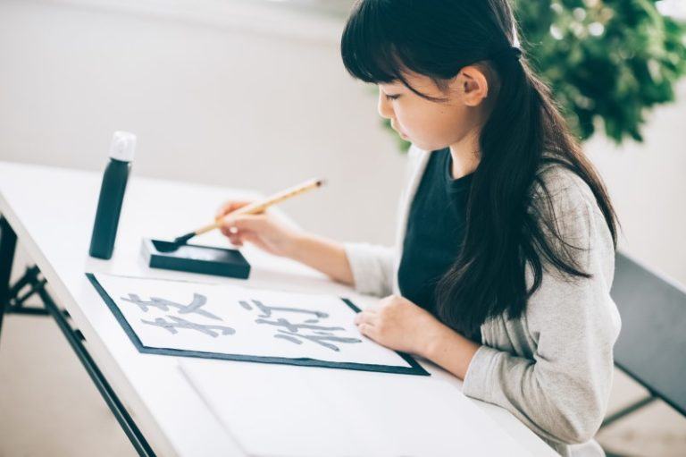 Girl writing Japanese