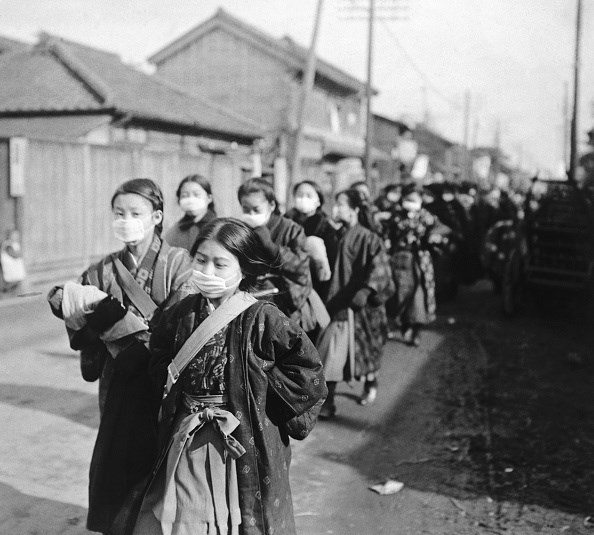 Japanese school girls wear protective masks to guard against the influenza outbreak.