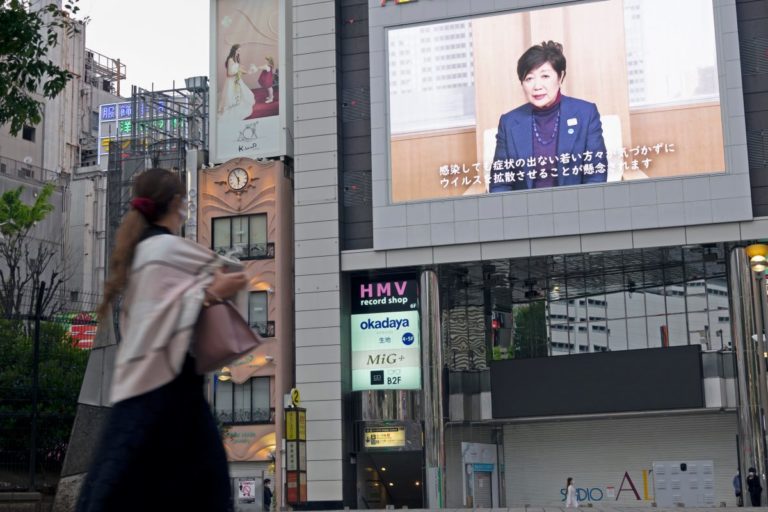Koike Yuriko projected on a screen in Tokyo