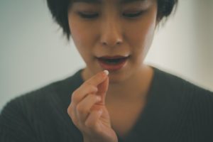 Woman taking pill