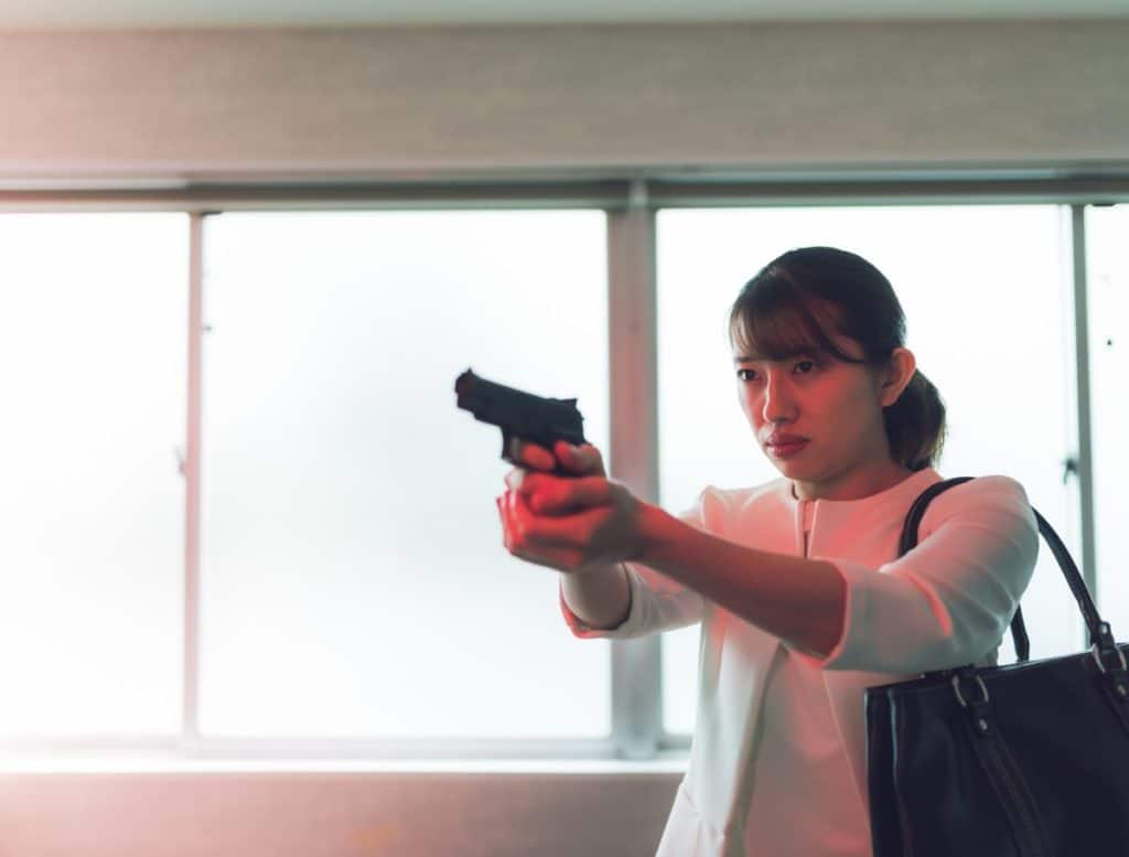 Japan gun laws: woman holding gun