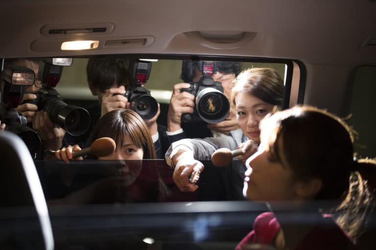Mass media trying to interview celebrity