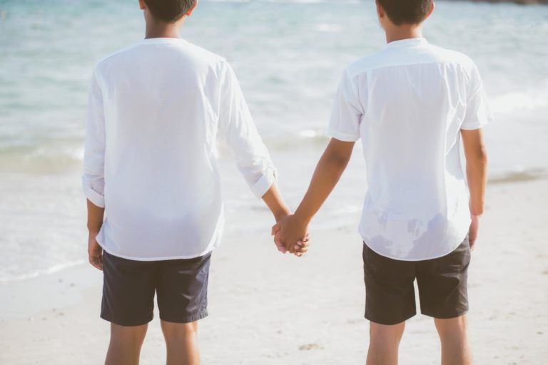 Male couple holding hands