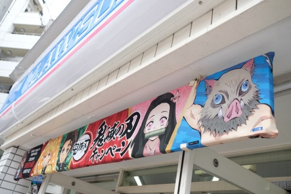 Demon Slayer ad outside of Family Mart