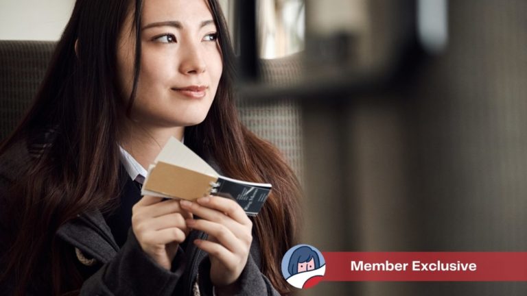 Woman studying vocabulary from flash cards