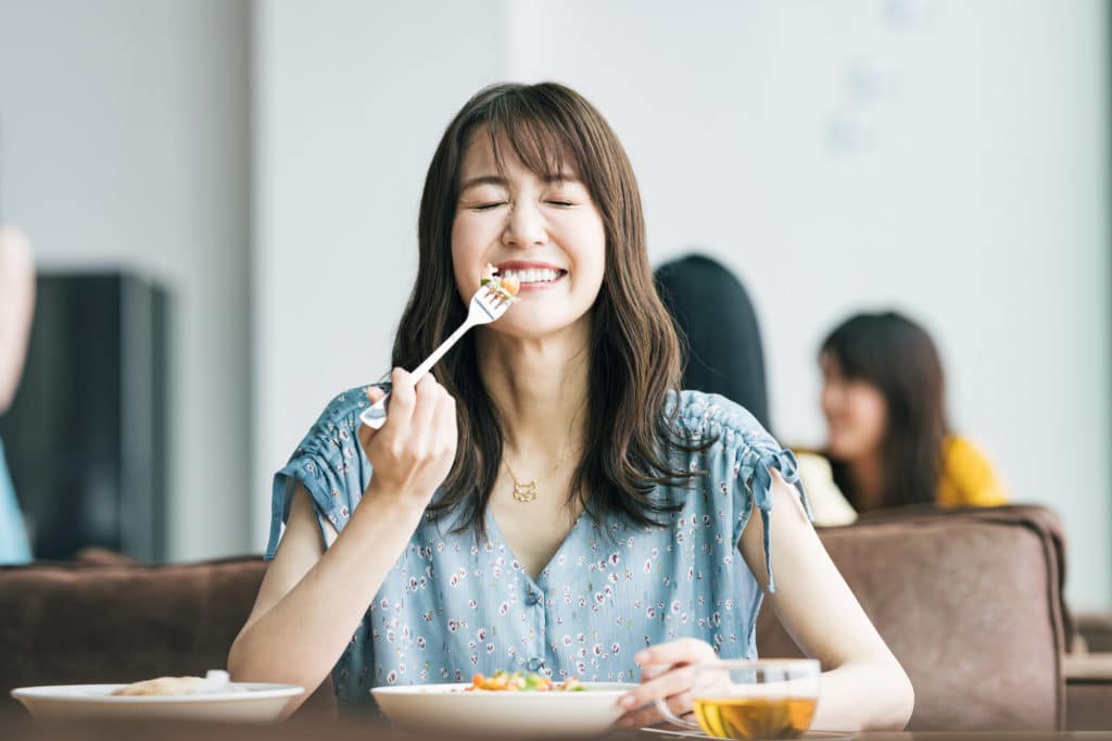 Single woman enjoying food