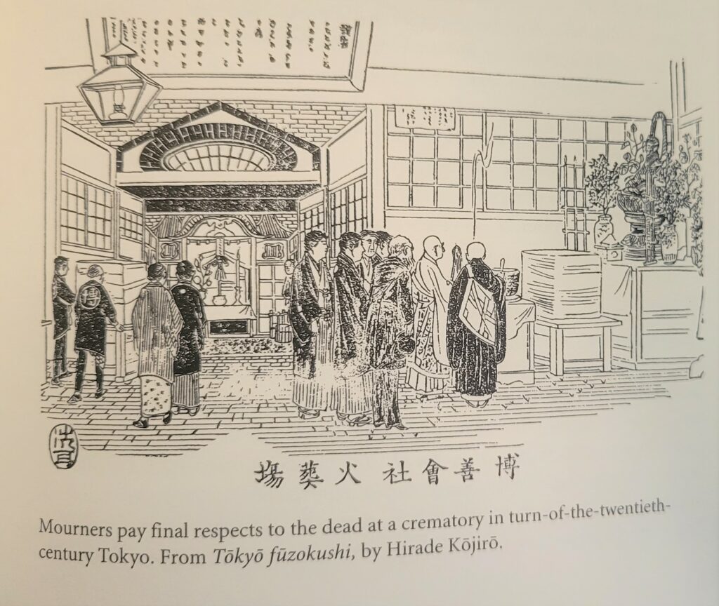 Japanese mourners gather at a modern crematorium in the early 20th century.