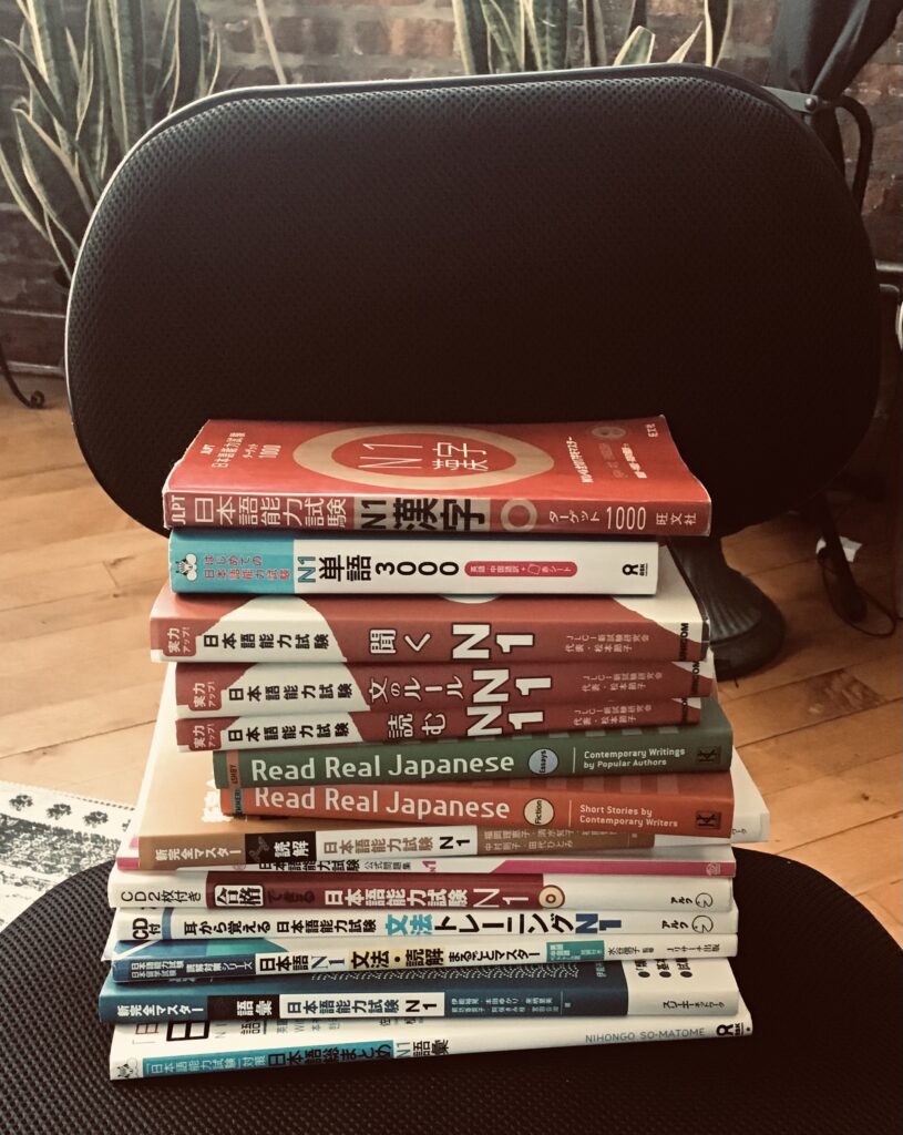 Photo of a stack of JLPT study guides.