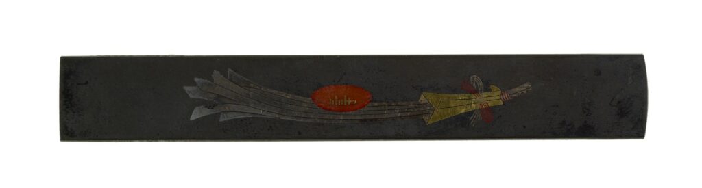 A decorative handle for a sword with foraged food imagery, related to the topic of Eating Wild Japan.