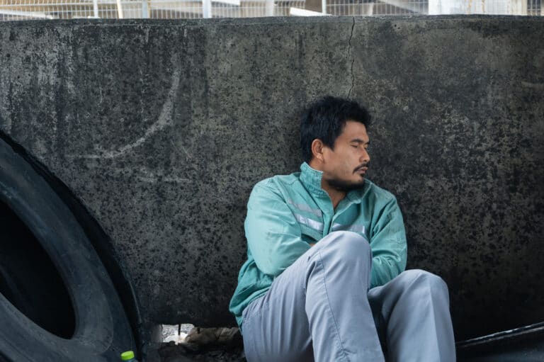 An image of a homeless man, much like those Daigo disparaged.