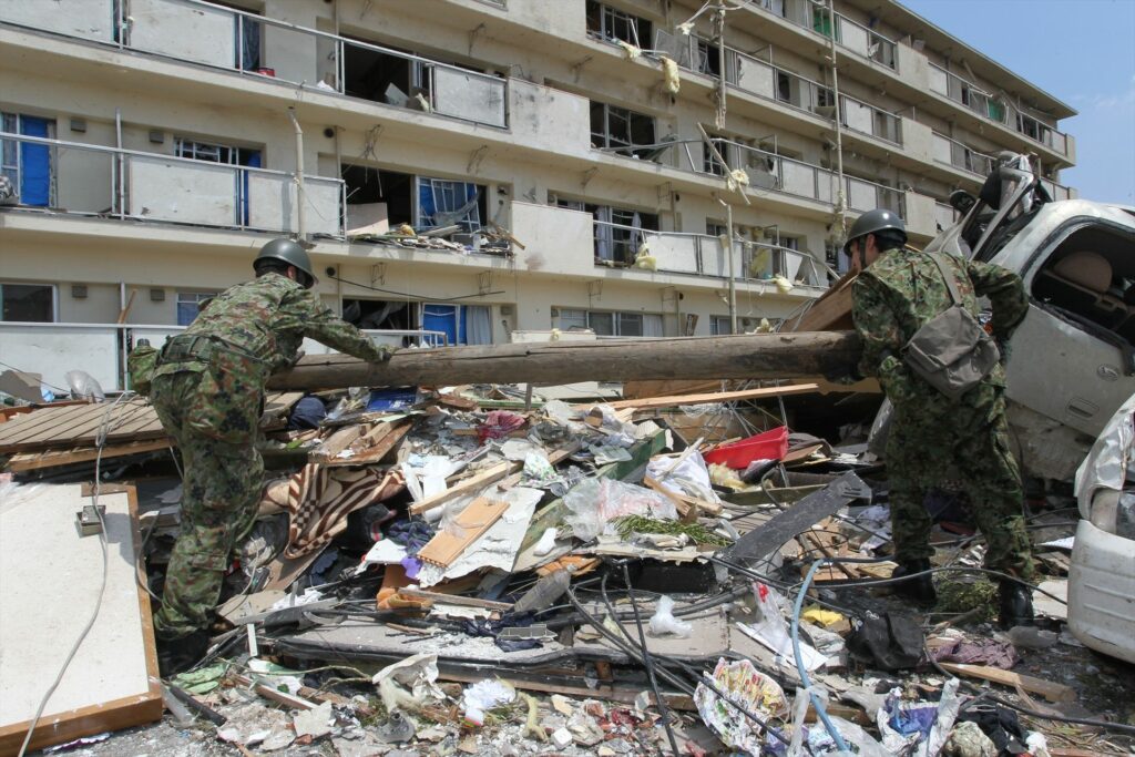 JSDF members shift through debris caused by a 2012 tornado in Tsukuba, Ibaraki Prefecture.