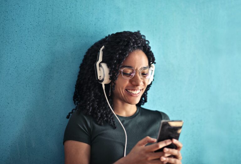 Woman with headphones and cell phone