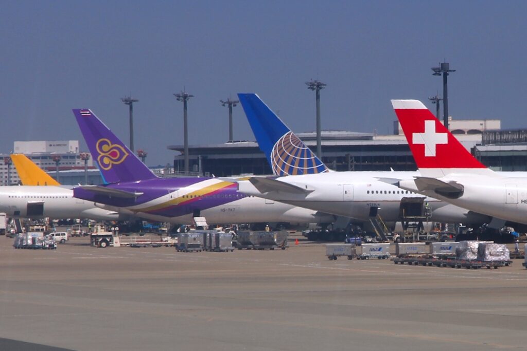 Airplanes at Narita Airport, the customs turnstiles of which represent the border by which most travelers enter Japan.