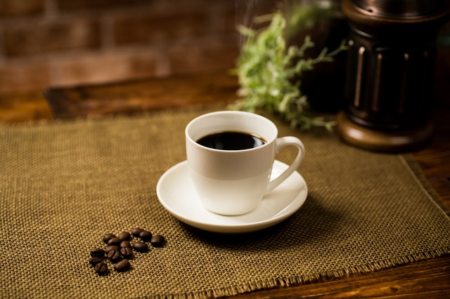 Cup of coffee and coffee beans. Coffee in Japan