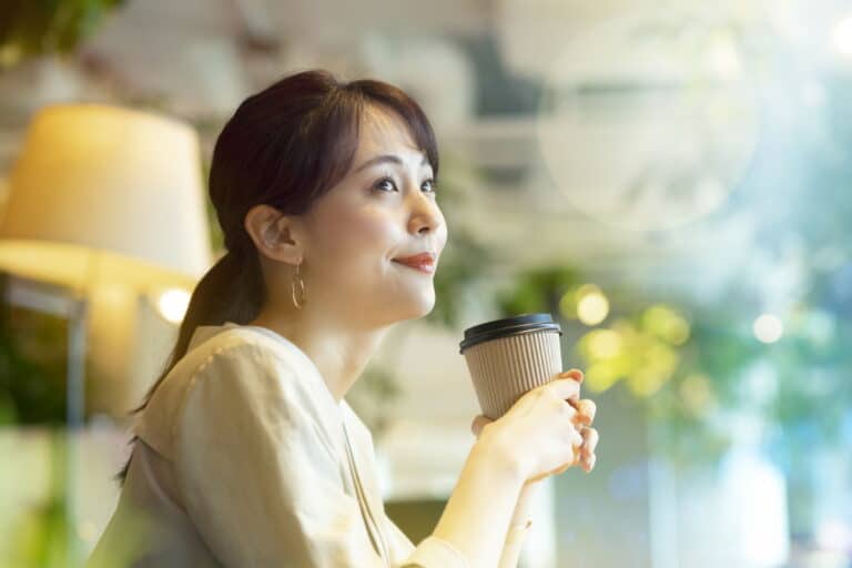 Woman drinks coffee in Japan
