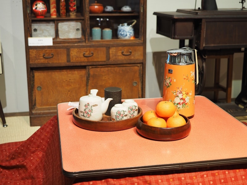 Mandarins and a tea set on top of a modern kotatsu.