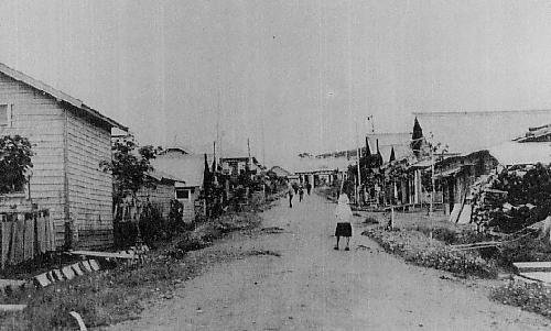 Rustic homes line a street in pre-war Kunashir Island in the southern Kuriles.