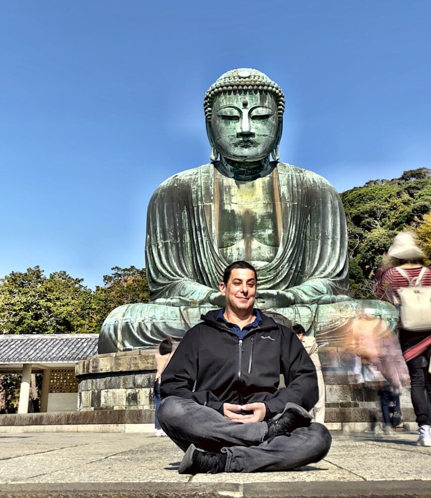 Jake Adelstein feeling beatific in front of the Kamakura Daibutsu.