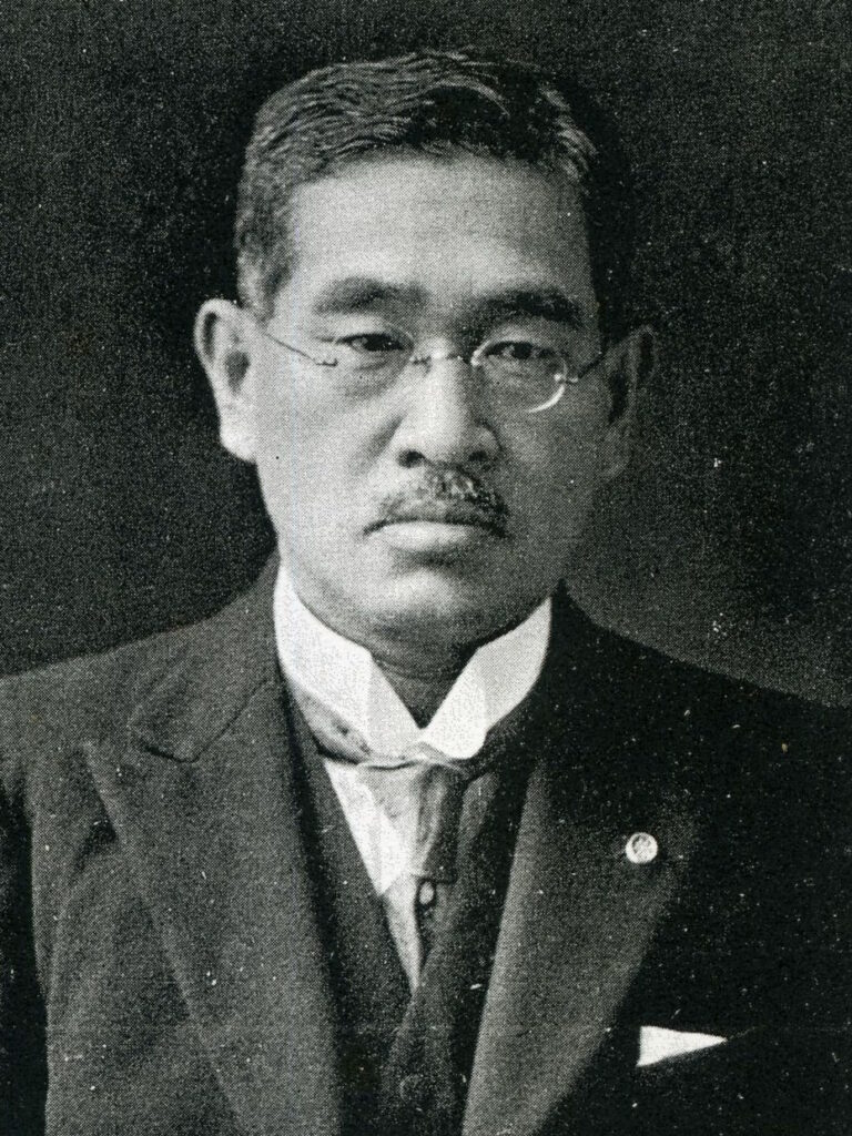 A bespeckled man in an early 20th century suite, Matsuda Genji hated the use of "mama" and "papa" by Japanese children.