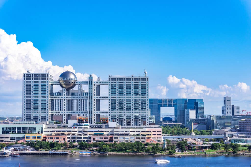 Fuji Television HQ stands above the waters of Tokyo Bay; it's a boxy silver building with a strange ball-shaped feature at the top.