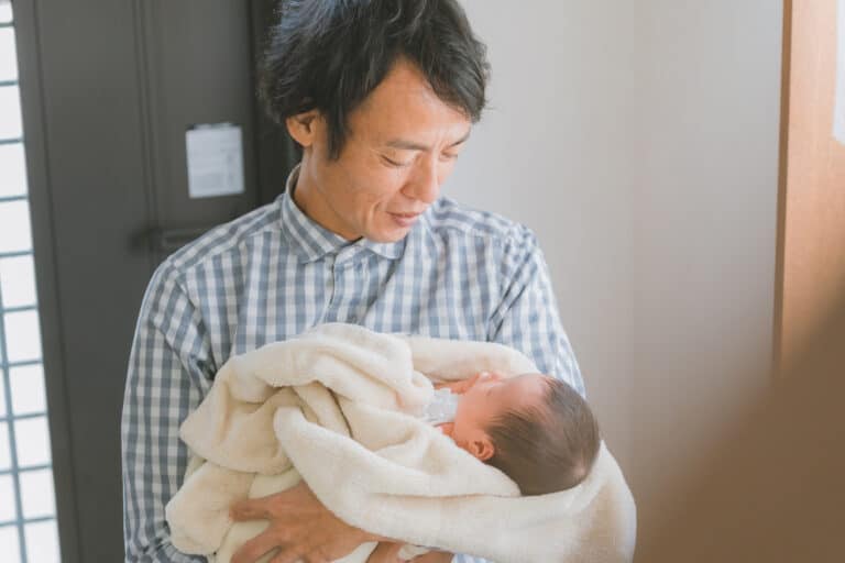 Dad holding his baby