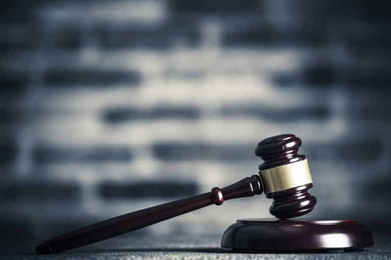 Picture of judge's hammer against a blurred background