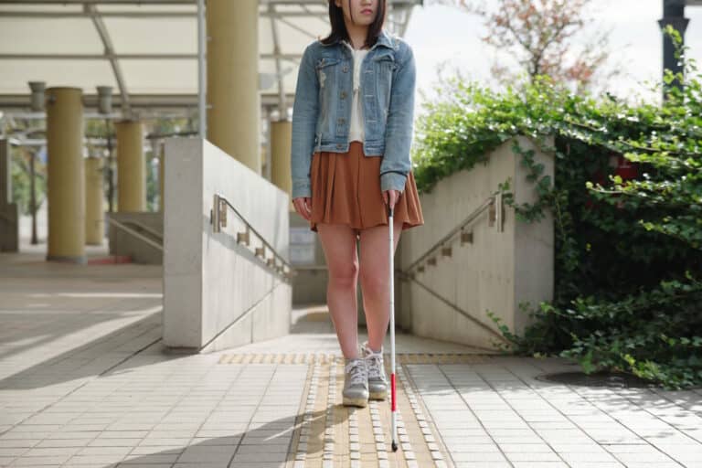 Blind woman walking