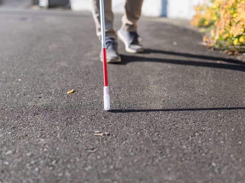 Blind person using a cane