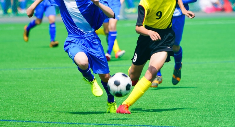Is this play egui? You decide! (Pictured: Two soccer players competing to kick a ball) 