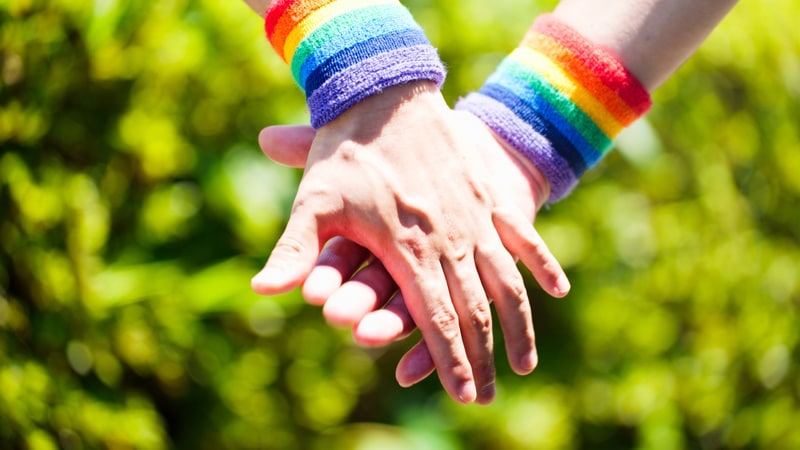 LGBTQ couple holding hands