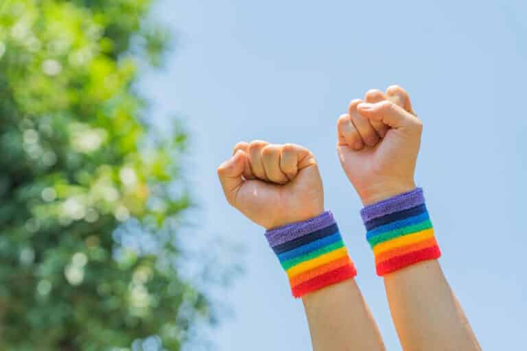 LGBTQ people holding fists in the air