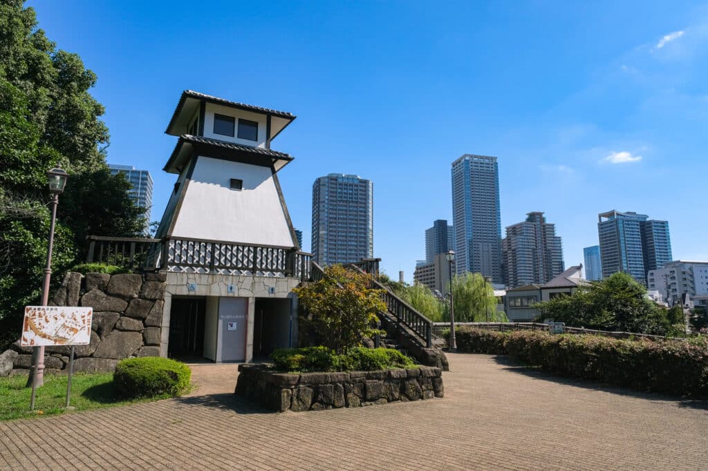 Tsukudajima park, with a yagura=style tower in front of high rise apartments.