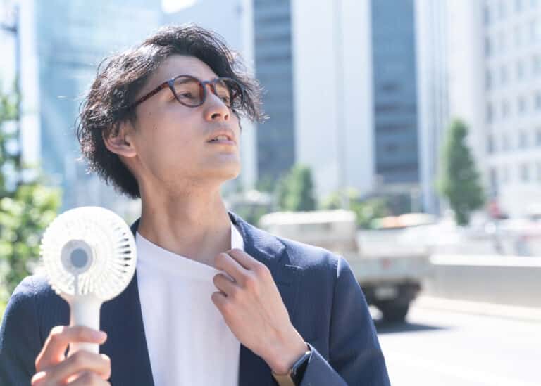 Man fanning himself to beat the heat