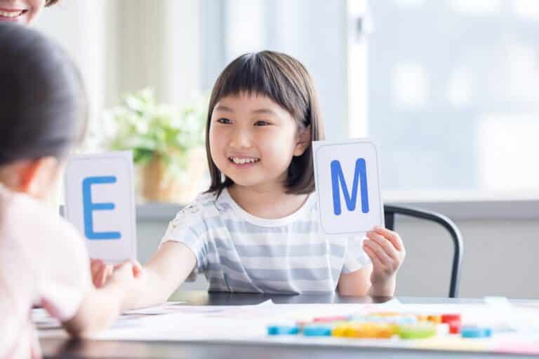 Girl learning her ABCs