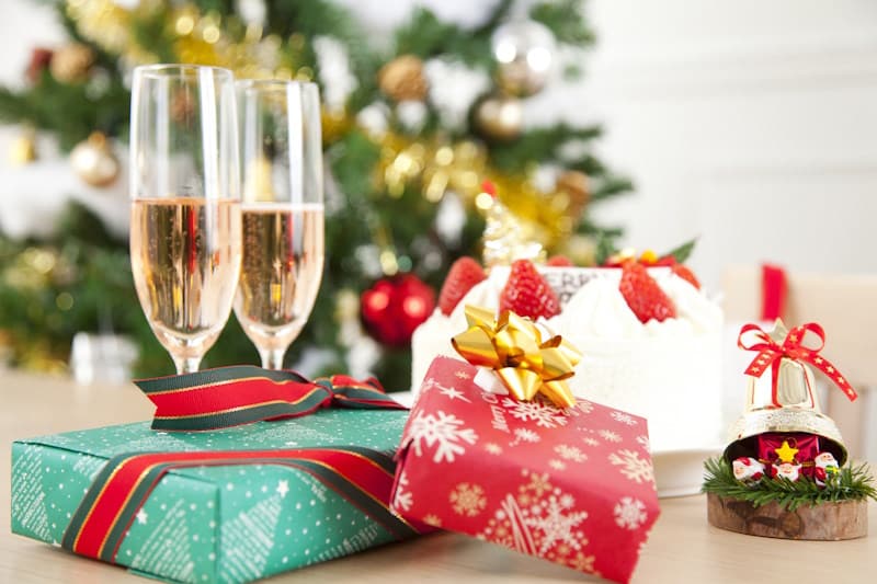 Christmas cake, gifts, and champagne for two