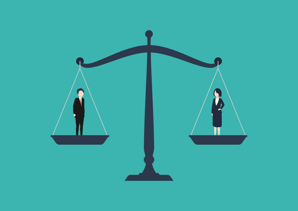 Man and woman balanced against each other on scales