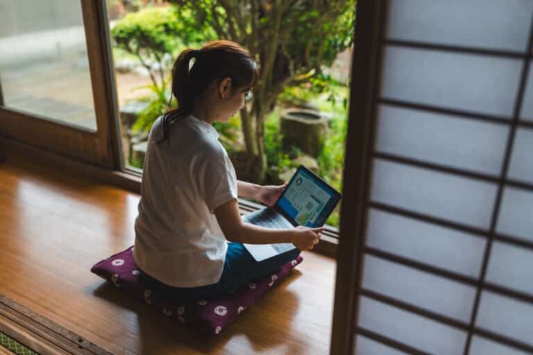 Woman working from home - digital nomad visa story